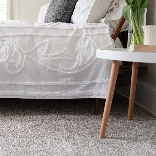 Bed and coffee table on the rug - Nantahala Flooring Outlet in Franklin